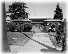 Prairie Style single story home, broad overhangs, leaded glass, printed plans